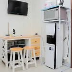 Comfy And Warm Studio Grand Kamala Lagoon Apartment By Travelio
